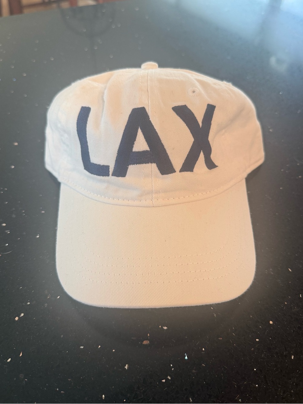 LAX Embroidered Baseball Cap - Cream with Black Lettering